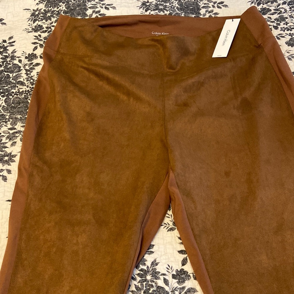 Selling a brand new pair of Calvin Klein faux suede tan pants, size 2X.